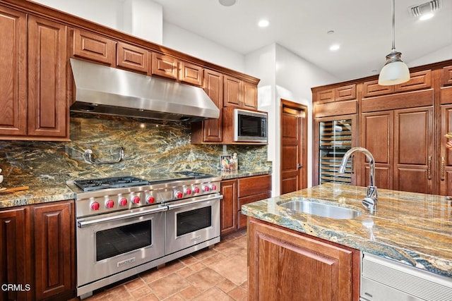 1533 Rancho Ave, Glendale, CA 91201 - kitchen with range with two ovens, under cabinet range hood, built in microwave, beverage cooler, and backsplash