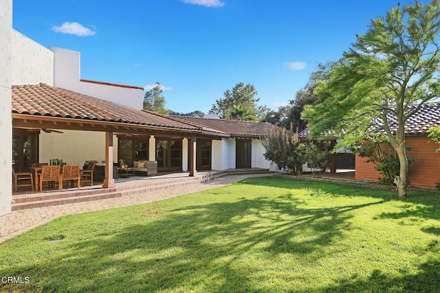 1533 Rancho Ave, Glendale, CA 91201 - back of house with an outdoor hangout area, a yard, a tiled roof, and stucco siding
