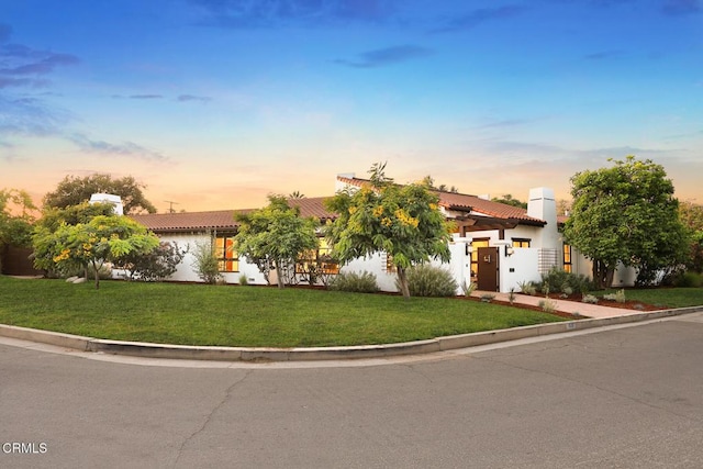 1533 Rancho Ave, Glendale, CA 91201 - mediterranean / spanish home with a tiled roof, stucco siding, a lawn, and a garage