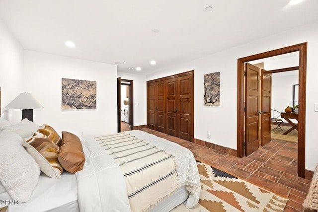 1533 Rancho Ave, Glendale, CA 91201 - bedroom with a closet, recessed lighting, stone finish floors, and washer and dryer