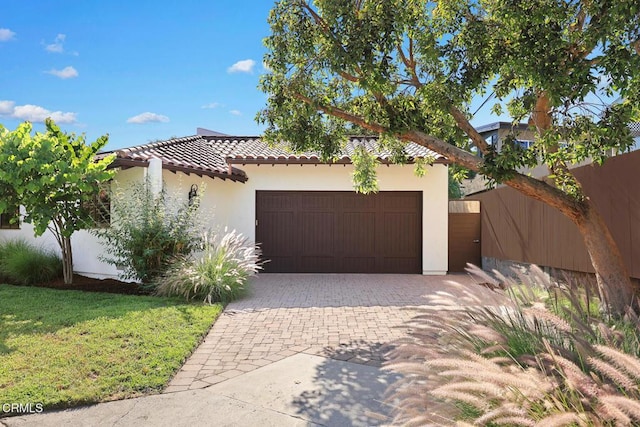 1533 Rancho Ave, Glendale, CA 91201 - mediterranean / spanish home with a garage, a tile roof, decorative driveway, and stucco siding