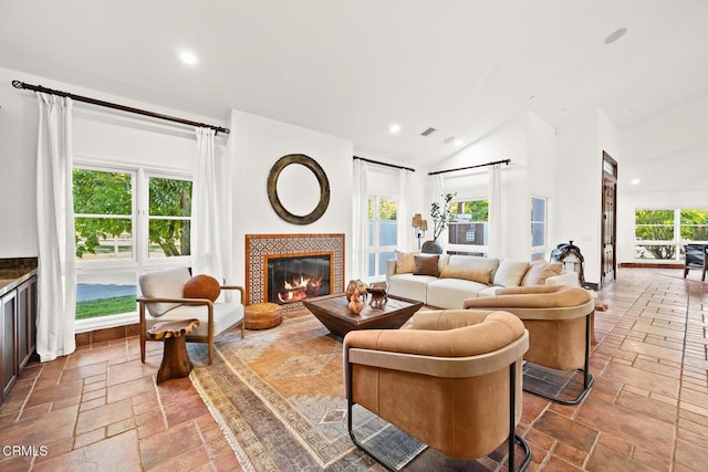 1533 Rancho Ave, Glendale, CA 91201 - living room with recessed lighting, stone tile flooring, a tiled fireplace, and high vaulted ceiling