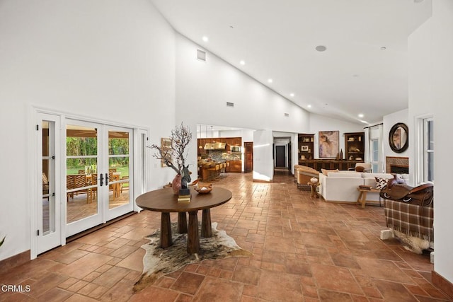 1533 Rancho Ave, Glendale, CA 91201 - living area featuring high vaulted ceiling, french doors, stone tile floors, recessed lighting, and a fireplace