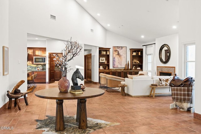 1533 Rancho Ave, Glendale, CA 91201 - living area with high vaulted ceiling, a tiled fireplace, and recessed lighting