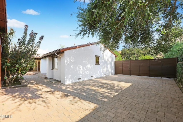 1533 Rancho Ave, Glendale, CA 91201 - view of property exterior featuring crawl space, stucco siding, and a patio area