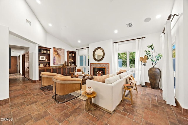 1533 Rancho Ave, Glendale, CA 91201 - living area with a warm lit fireplace, stone tile floors, recessed lighting, and vaulted ceiling