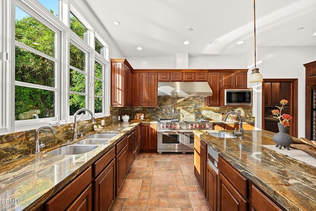 1533 Rancho Ave, Glendale, CA 91201 - kitchen with stainless steel appliances, ventilation hood, backsplash, stone tile flooring, and dark stone countertops