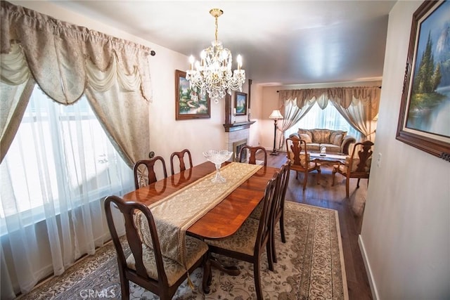 20716 Community St, Winnetka, CA 91306 - dining space with wood finished floors and a chandelier
