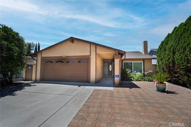 20716 Community St, Winnetka, CA 91306 - single story home featuring stucco siding, driveway, and an attached garage