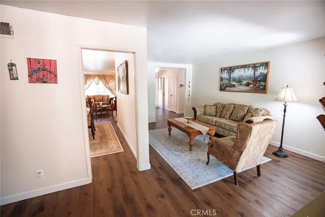 20716 Community St, Winnetka, CA 91306 - living area with baseboards and dark wood finished floors
