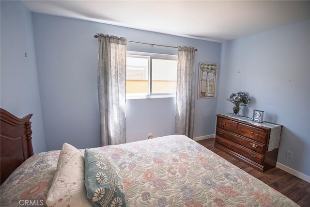 20716 Community St, Winnetka, CA 91306 - bedroom with dark wood-type flooring and baseboards