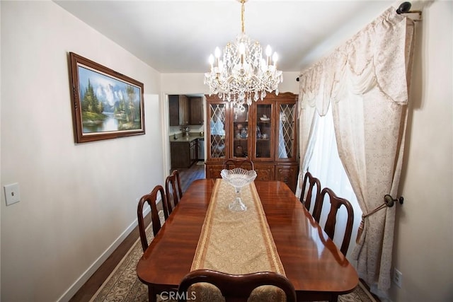 20716 Community St, Winnetka, CA 91306 - dining room with wood finished floors and a chandelier