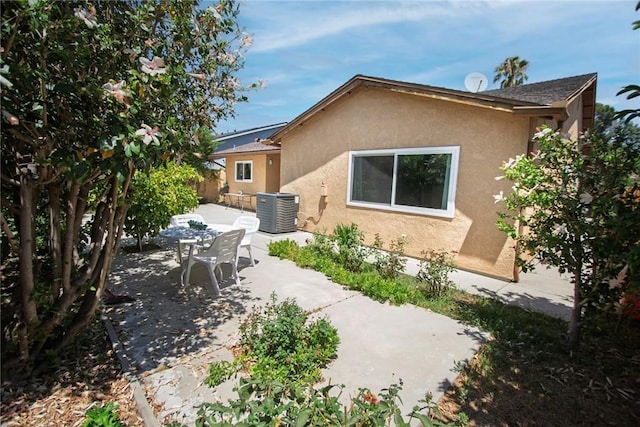 20716 Community St, Winnetka, CA 91306 - rear view of property featuring stucco siding and a patio area