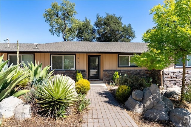 5155 Ardilla Ave, Atascadero, CA 93422 - view of front of property featuring stone siding, a shingled roof, and board and batten siding