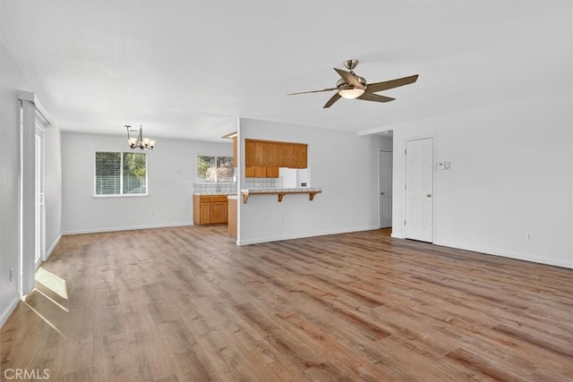 4729 Lookout Mountain Rd, Mariposa, CA 95338 - unfurnished living room with a chandelier, light wood finished floors, and ceiling fan