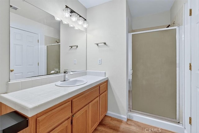 4729 Lookout Mountain Rd, Mariposa, CA 95338 - bathroom featuring vanity, a stall shower, and wood finished floors