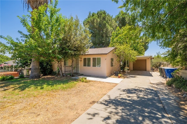 3986 Tomlinson, Riverside, CA 92503 - view of front of home featuring driveway, stucco siding, and a front yard