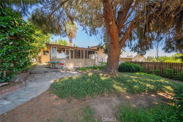 3986 Tomlinson, Riverside, CA 92503 - back of property featuring stucco siding, a sunroom, and a patio area