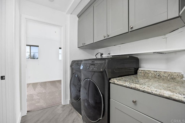 11375 Affinity Ct Unit 206, San Diego, CA 92131 - washroom featuring cabinet space, washing machine and dryer, and light wood-type flooring