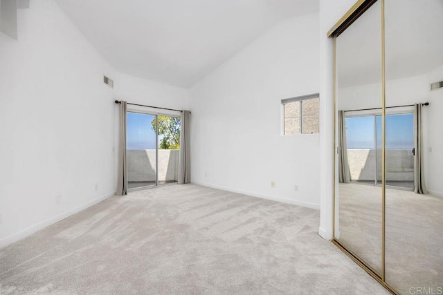 11375 Affinity Ct Unit 206, San Diego, CA 92131 - unfurnished bedroom featuring high vaulted ceiling, access to outside, and carpet floors