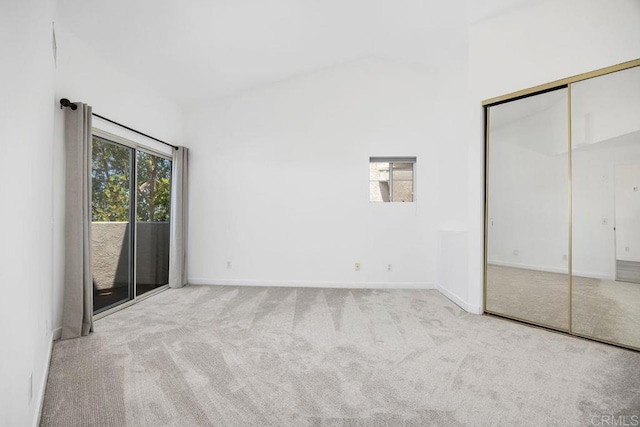 11375 Affinity Ct Unit 206, San Diego, CA 92131 - unfurnished bedroom with carpet, access to exterior, lofted ceiling, and a closet
