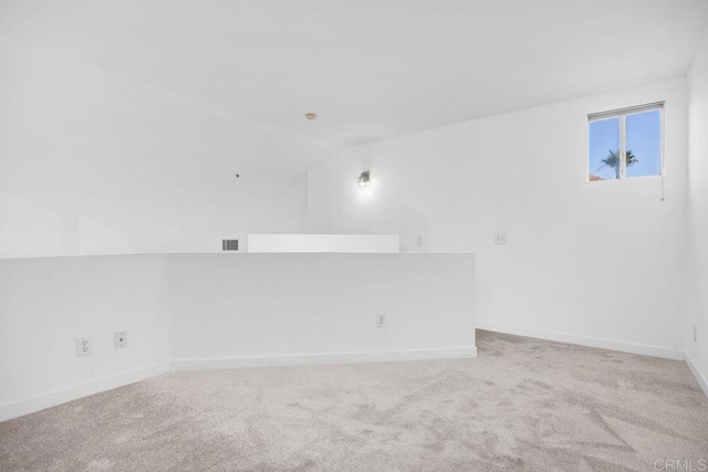 11375 Affinity Ct Unit 206, San Diego, CA 92131 - empty room with light colored carpet and vaulted ceiling