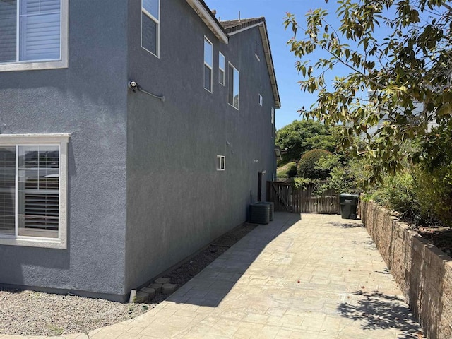 106 Chesapeake Ct, San Marcos, CA 92069 - view of home's exterior with stucco siding and a patio