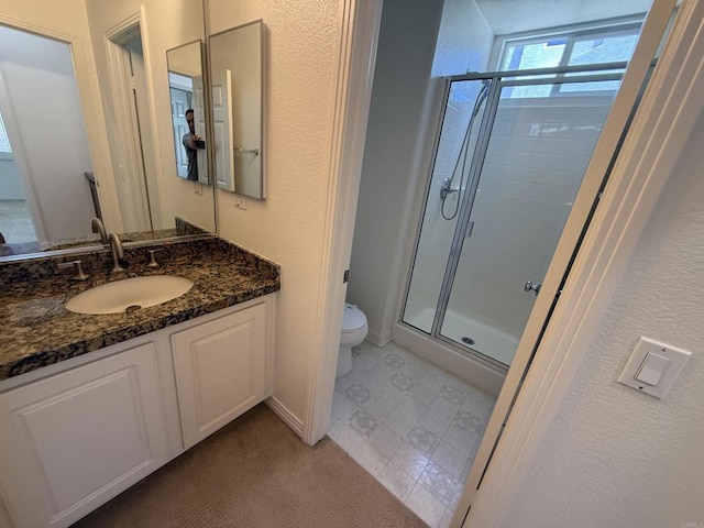 106 Chesapeake Ct, San Marcos, CA 92069 - bathroom featuring a shower stall, vanity, and a textured wall