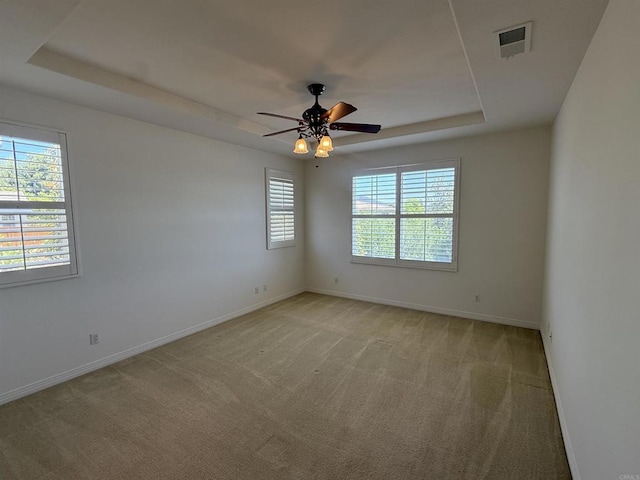 106 Chesapeake Ct, San Marcos, CA 92069 - spare room featuring a raised ceiling, light carpet, and a ceiling fan