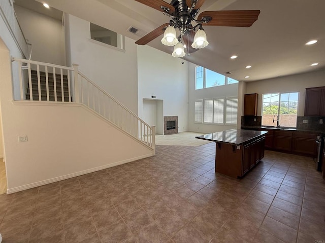 106 Chesapeake Ct, San Marcos, CA 92069 - kitchen with a ceiling fan, dark countertops, recessed lighting, open floor plan, and backsplash
