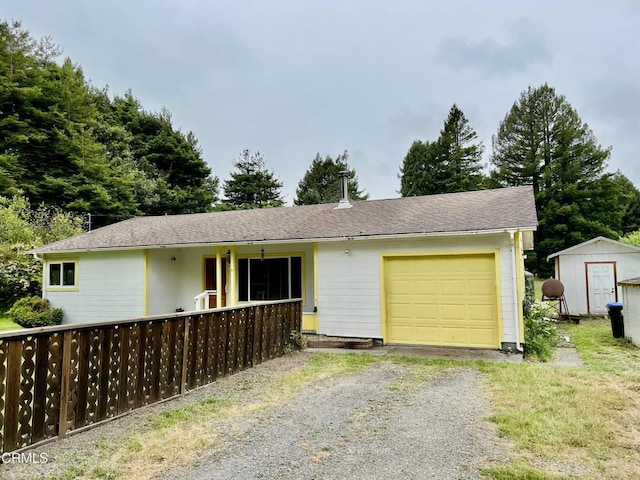 21560 Bald Hill Rd, Fort Bragg, CA 95437 - ranch-style house featuring a garage, a storage unit, and driveway