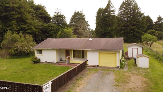 21560 Bald Hill Rd, Fort Bragg, CA 95437 - single story home featuring a storage shed, driveway, an attached garage, a front yard, and covered porch