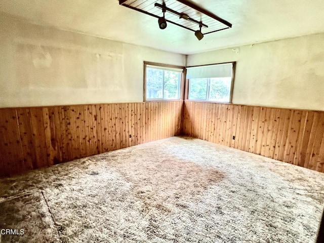 21560 Bald Hill Rd, Fort Bragg, CA 95437 - carpeted empty room with wood walls and wainscoting