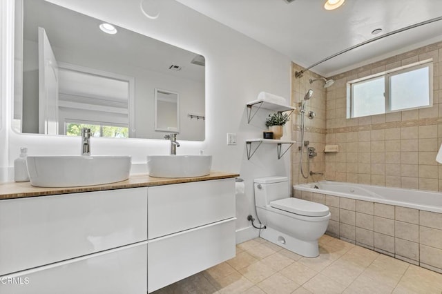 453 Frontenac Ave, Los Angeles, CA 90065 - bathroom featuring tiled shower / bath combo, healthy amount of natural light, tile patterned floors, double vanity, and recessed lighting