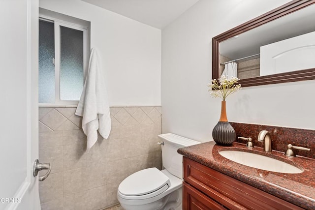 453 Frontenac Ave, Los Angeles, CA 90065 - bathroom featuring vanity, a shower with shower curtain, tile walls, and a wainscoted wall