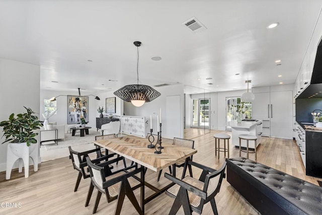 453 Frontenac Ave, Los Angeles, CA 90065 - dining room with healthy amount of natural light, light wood-type flooring, and recessed lighting