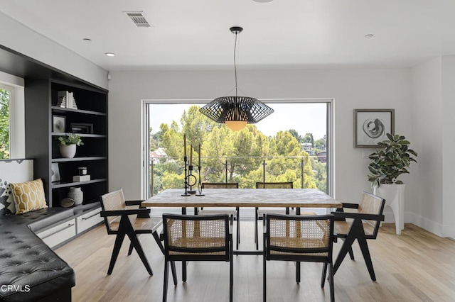 453 Frontenac Ave, Los Angeles, CA 90065 - dining room featuring light wood-type flooring, a chandelier, built in features, and recessed lighting