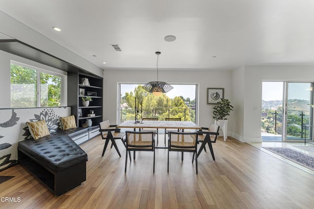 453 Frontenac Ave, Los Angeles, CA 90065 - dining area featuring light wood-type flooring, recessed lighting, built in shelves, and a chandelier