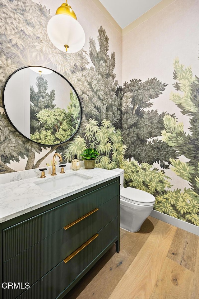 4828 Oakwood Ave, La Canada Flintridge, CA 91011 - bathroom with wallpapered walls, wood finished floors, and vanity