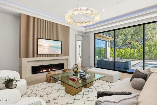 4828 Oakwood Ave, La Canada Flintridge, CA 91011 - living area with wood finished floors, a glass covered fireplace, plenty of natural light, and recessed lighting