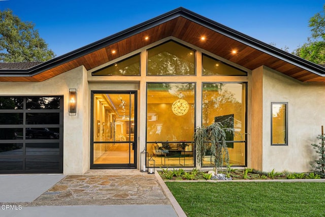 4828 Oakwood Ave, La Canada Flintridge, CA 91011 - doorway to property with stucco siding and a lawn