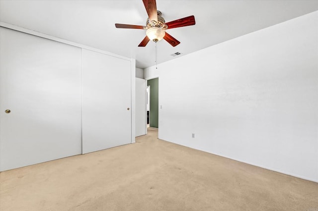 1235 Via Rancho Pkwy, Escondido, CA 92029 - unfurnished bedroom featuring light colored carpet, a closet, and a ceiling fan