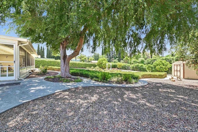 1235 Via Rancho Pkwy, Escondido, CA 92029 - view of yard with a shed, a sunroom, and a patio