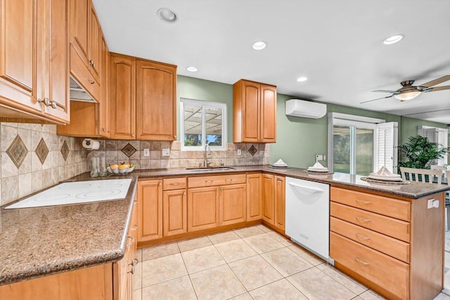 1235 Via Rancho Pkwy, Escondido, CA 92029 - kitchen with white appliances, a wall mounted air conditioner, a peninsula, healthy amount of natural light, and recessed lighting