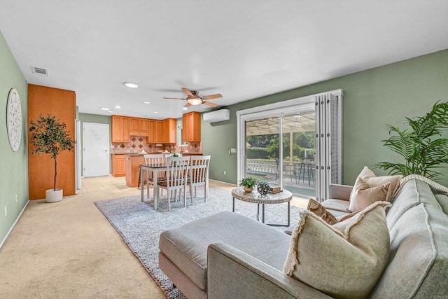 1235 Via Rancho Pkwy, Escondido, CA 92029 - living room with a wall mounted air conditioner, a ceiling fan, recessed lighting, and light colored carpet