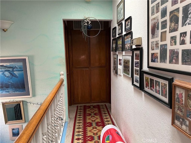 32078 Del Cielo Oeste, Bonsall, CA 92003 - hall with a textured wall and an upstairs landing
