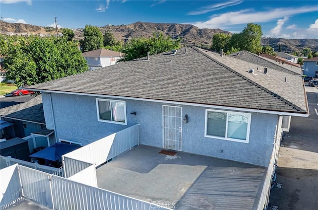 28023 Robin Ave, Saugus, CA 91350 - rear view of property with a shingled roof, a mountain view, and stucco siding
