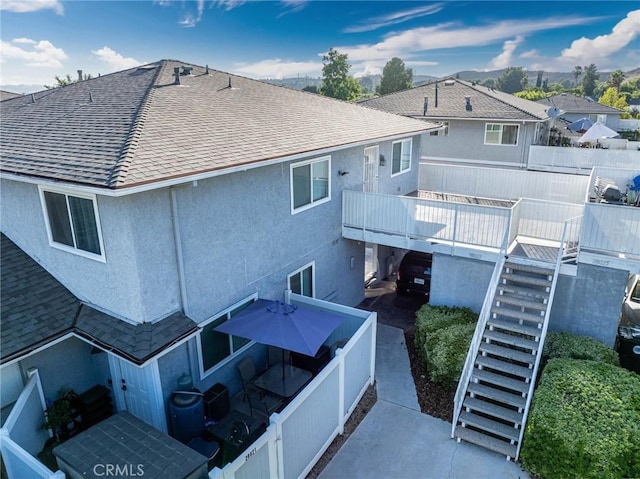 28023 Robin Ave, Saugus, CA 91350 - rear view of property with stairs, roof with shingles, and stucco siding