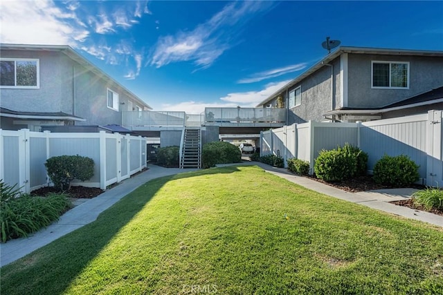 28023 Robin Ave, Saugus, CA 91350 - fenced backyard with a wooden deck and stairs