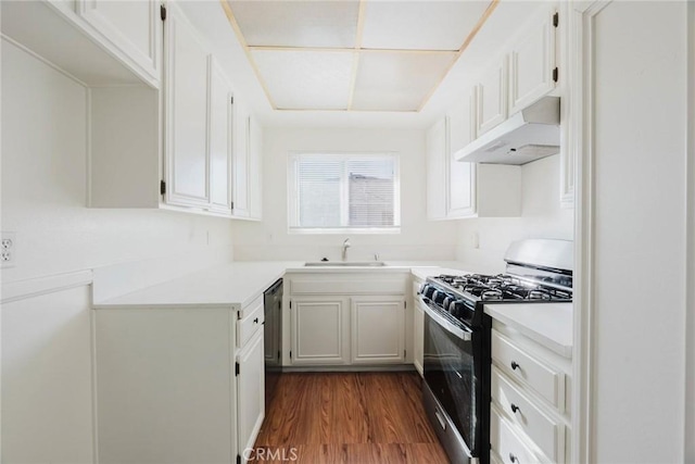 28023 Robin Ave, Saugus, CA 91350 - kitchen featuring gas range, under cabinet range hood, dark wood-style floors, and light countertops